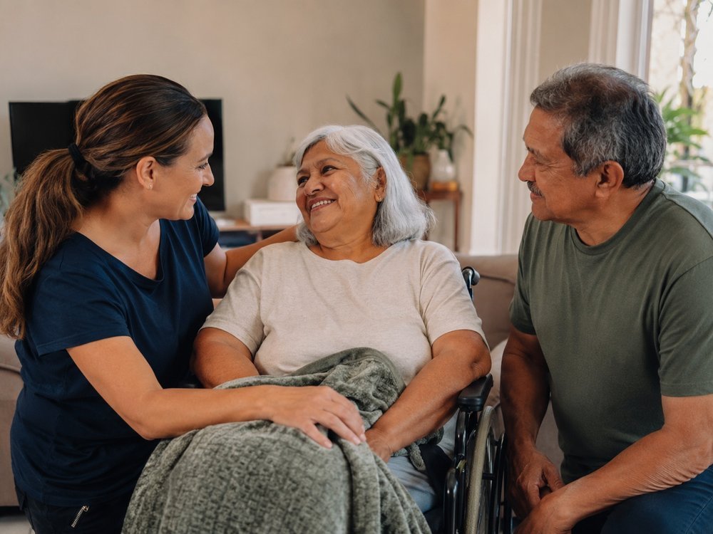 A support worker gently assisting a participant with their morning routine at home